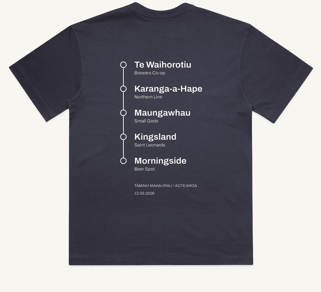 The back of the tee: the five stations printed as a vertical white line with five circular stops, Te Waihorotiu, Karanga-a-Hape, Maungawhau, Kingsland and Morningside, each with its venue named beneath it, above the words Tamaki Makaurau, Aotearoa and the date 13.09.2026.